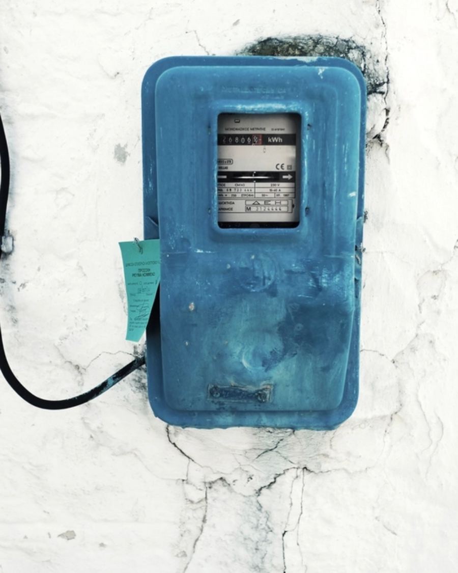 TNB electricity meter mounted on the exterior wall of a house